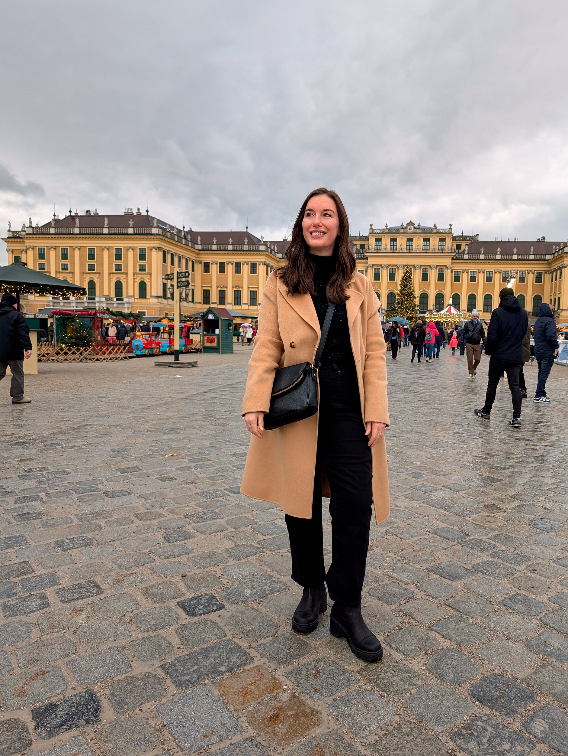 Alyssa outside of the Schönbrunn Palace Christmas Market in Vienna, Austria