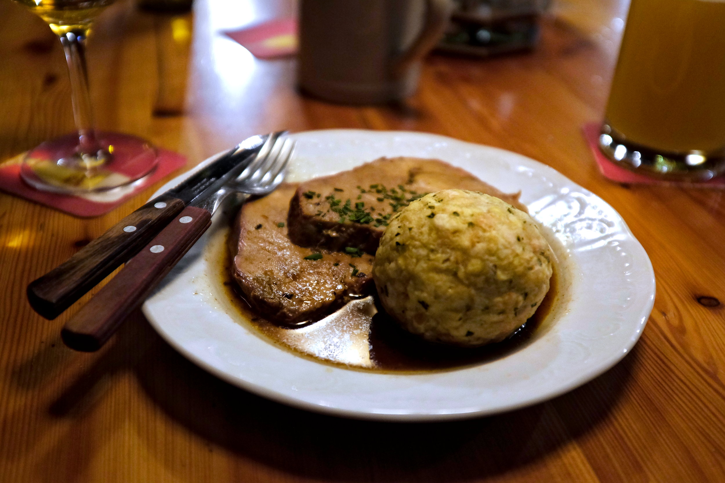 A dish with meat and dumplings