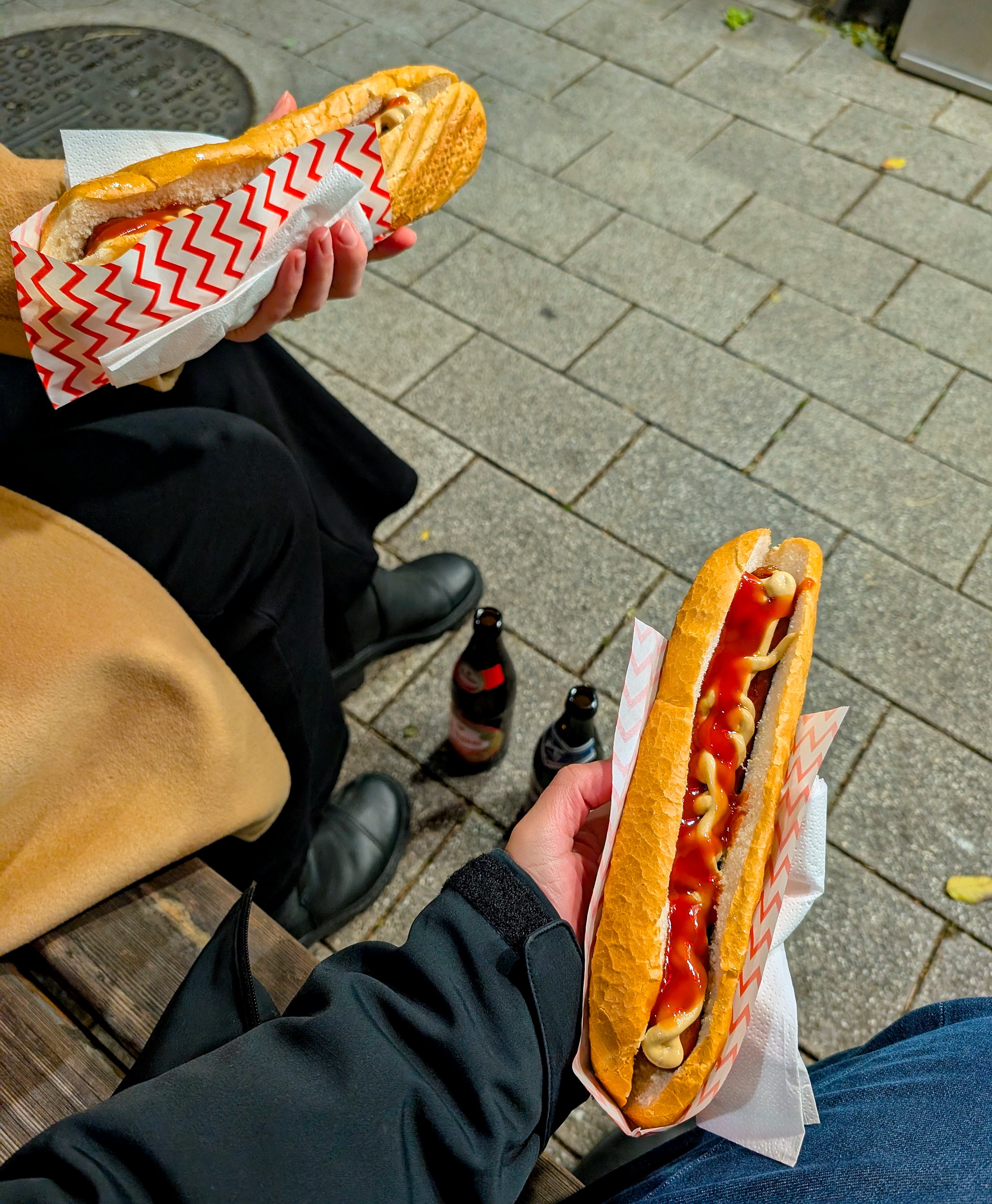 Alyssa and Michael hold a pair of käsekrainer