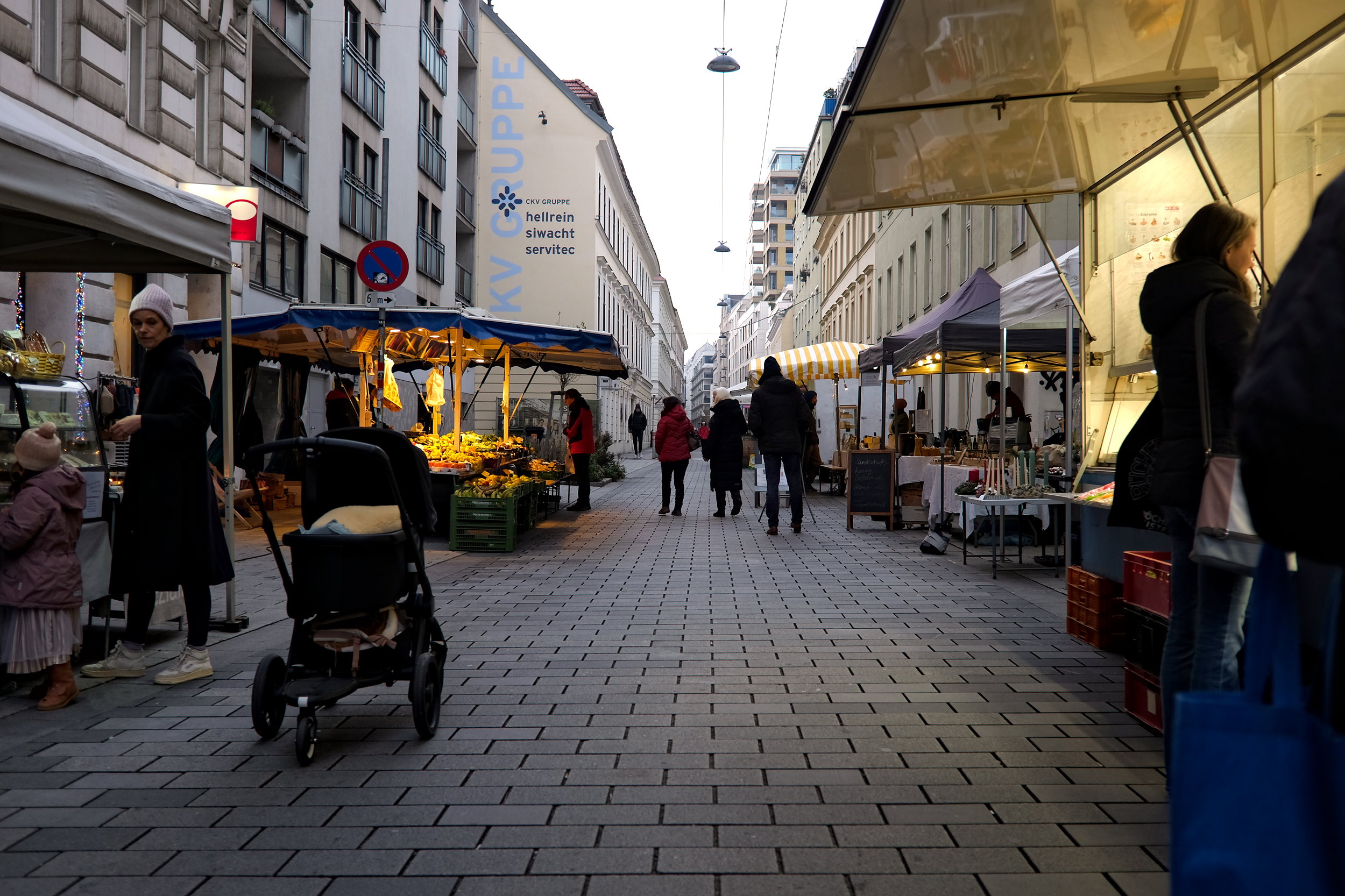 People stroll the market at Spittelberg