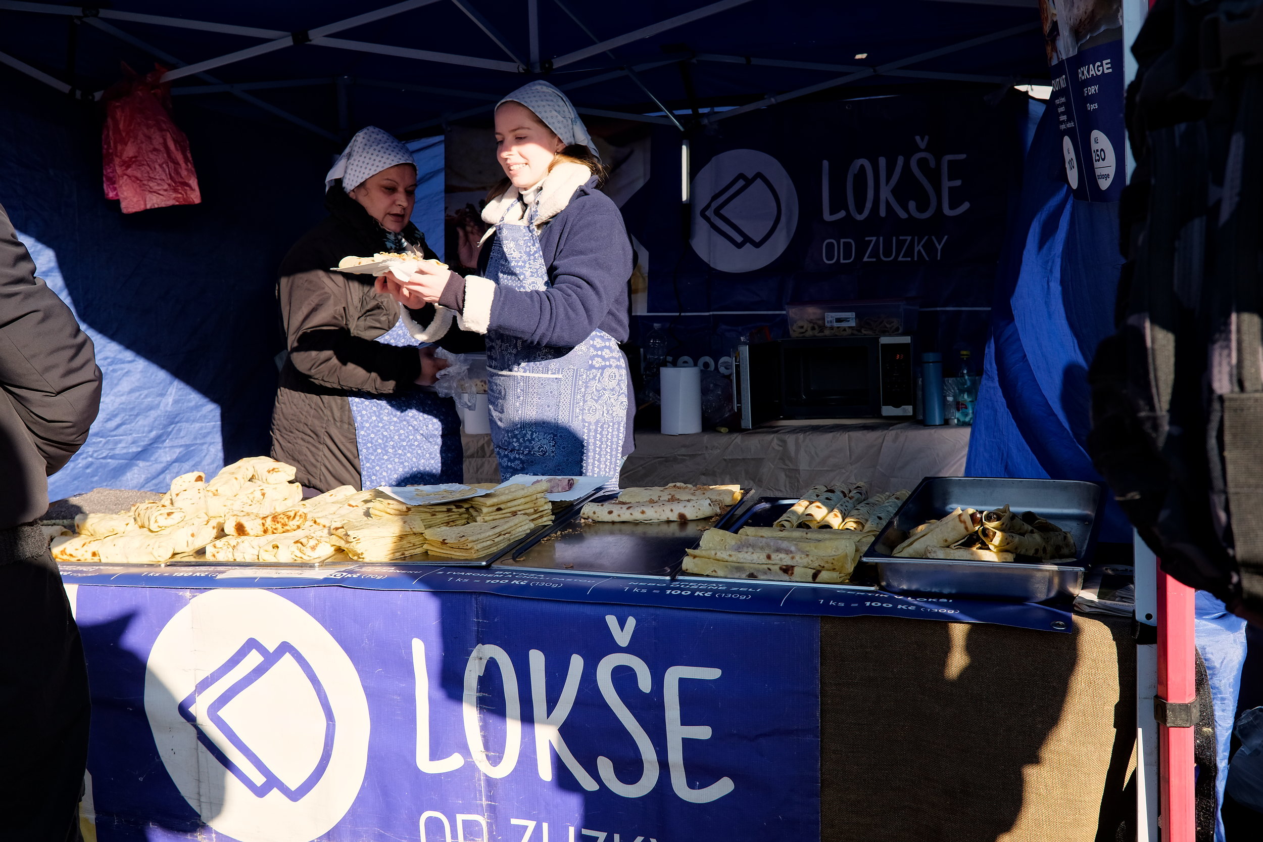 Vendors making Lokse at the Kulaťák Street Market