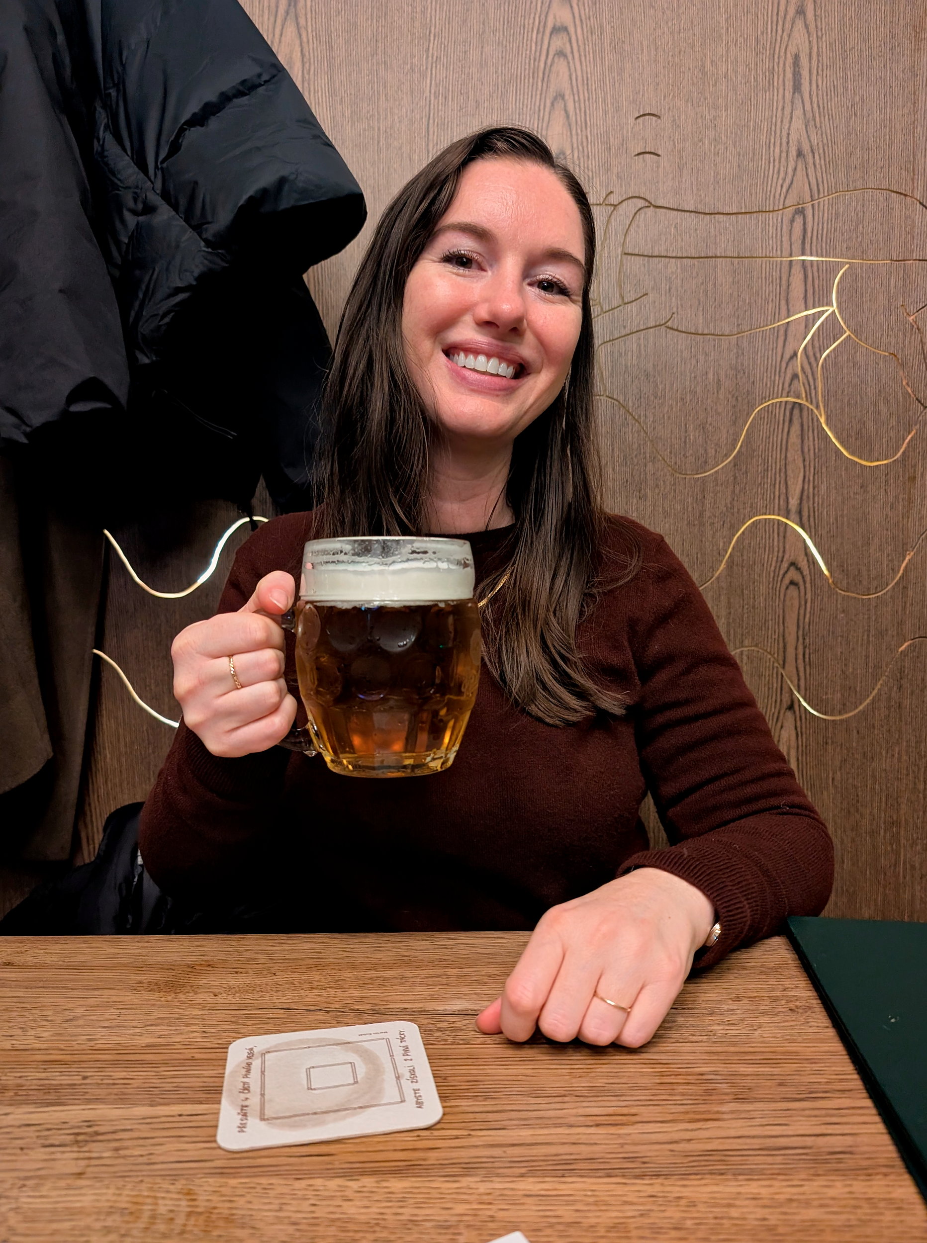 Alyssa holds a beer at Lokál