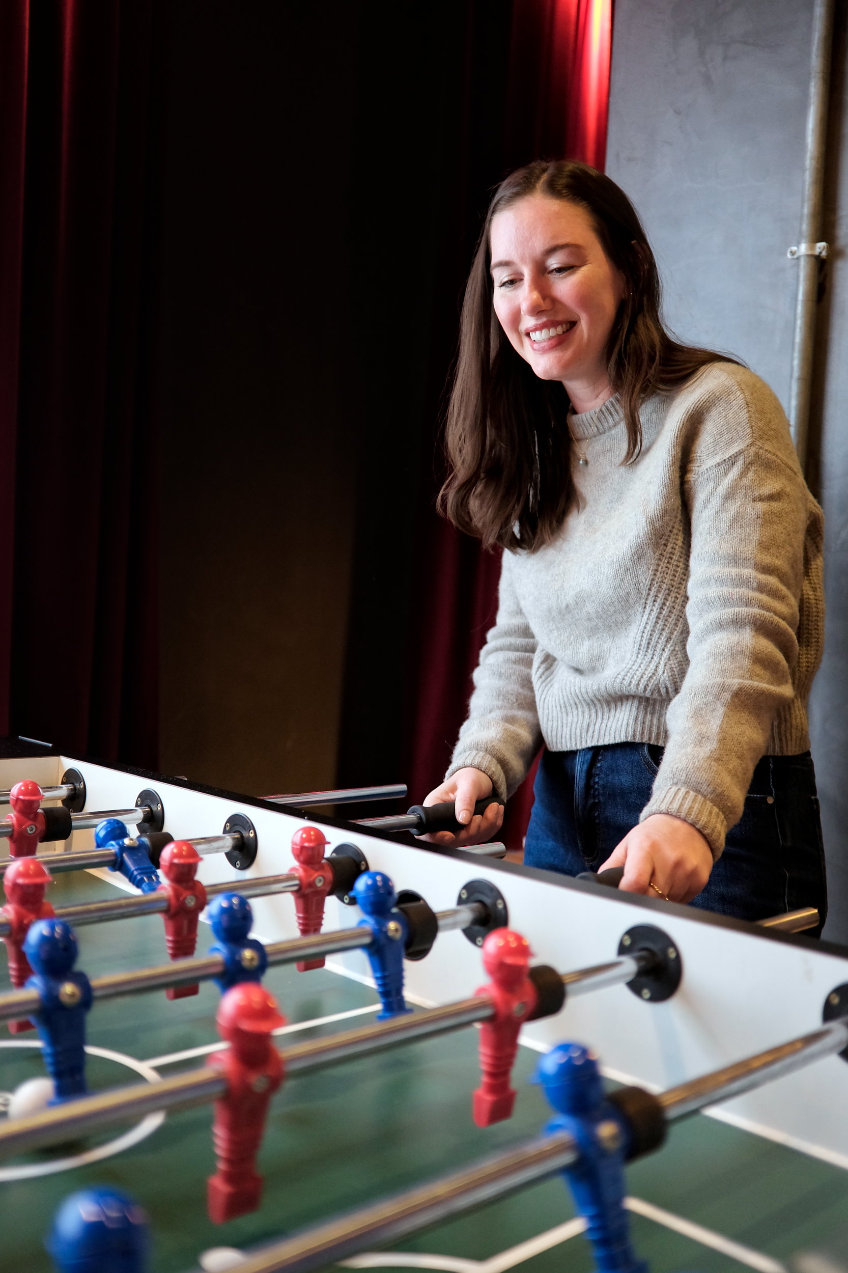 Alyssa plays foosball at Penta