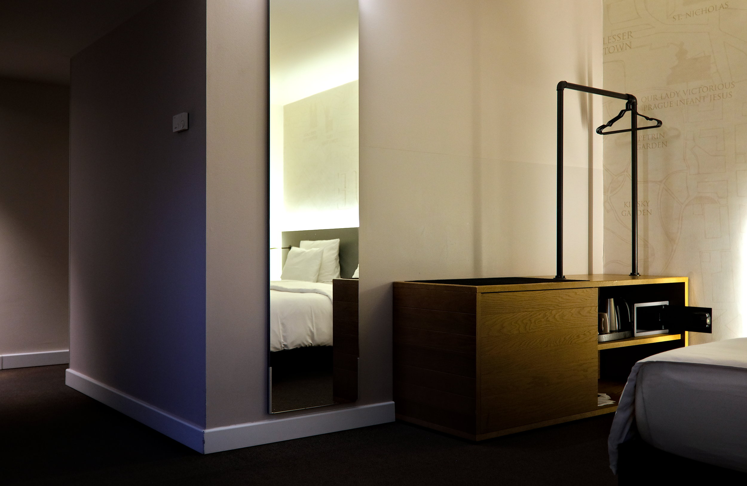 View of a Double room at Pentahotel Prague, with a wardrobe and a bed reflected in the mirror