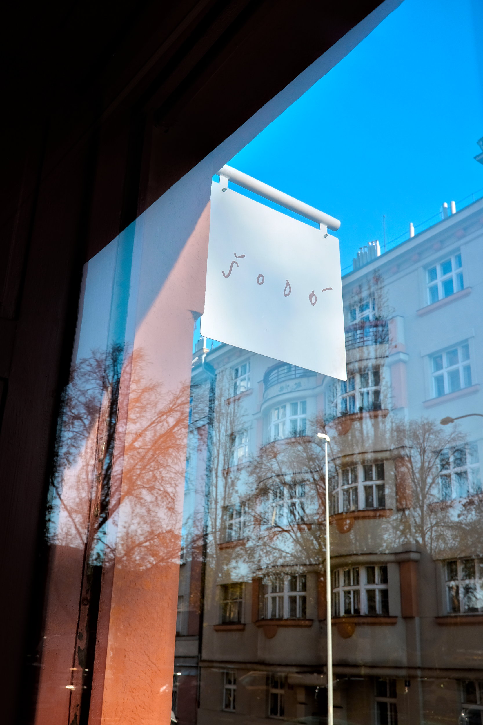 View of the Šodó sign through the window