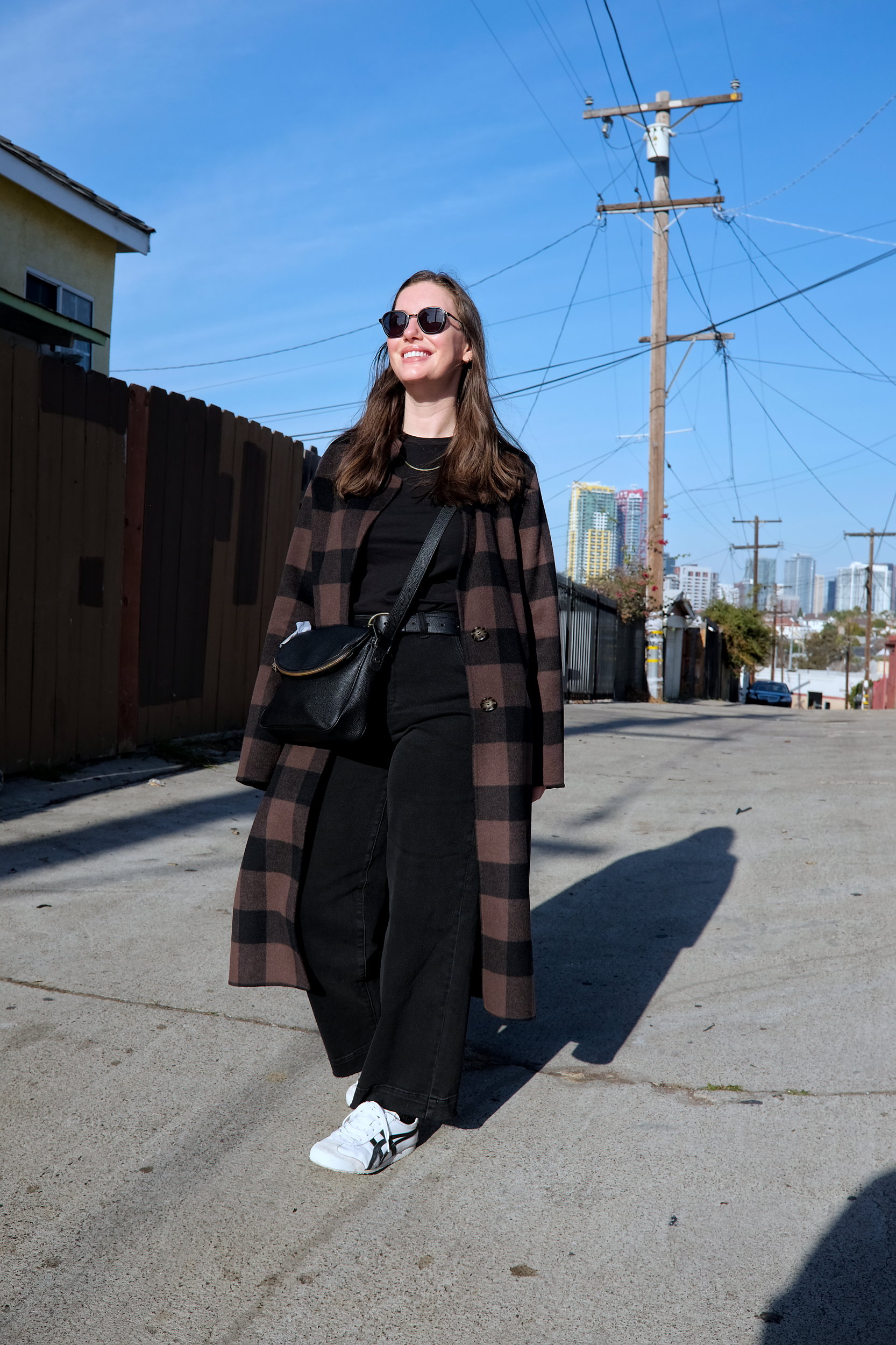 Alyssa walks down a street in San Diego, California