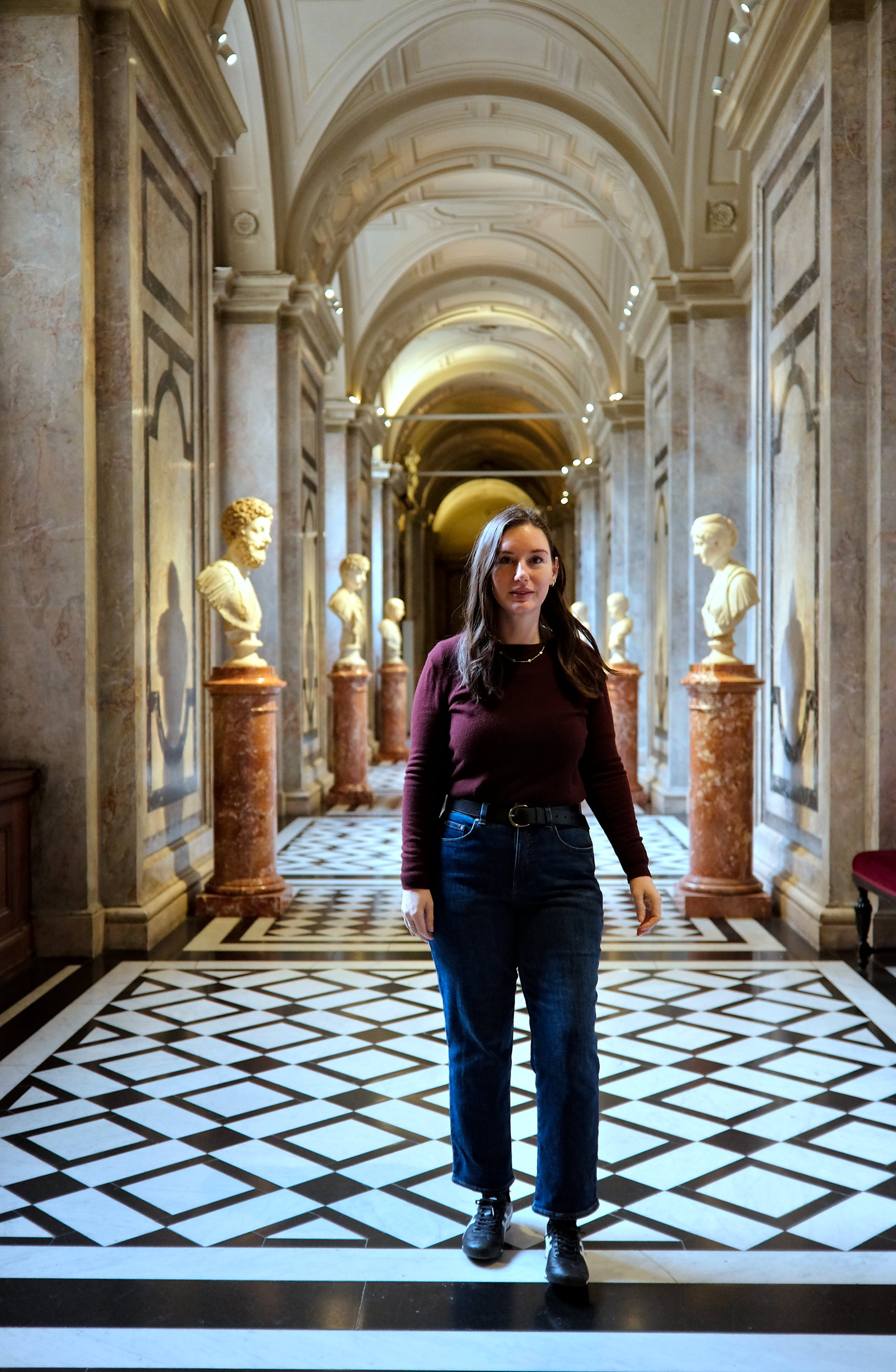 Alyssa at Kunsthistorisches Museum in a burgundy sweater and blue jeans