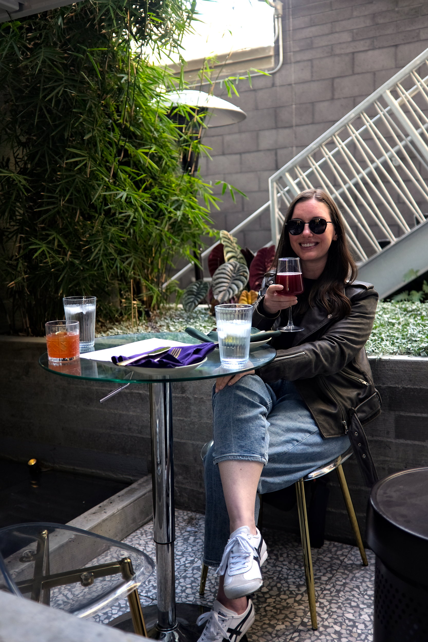 Alyssa at a San Diego restaurant with a drink