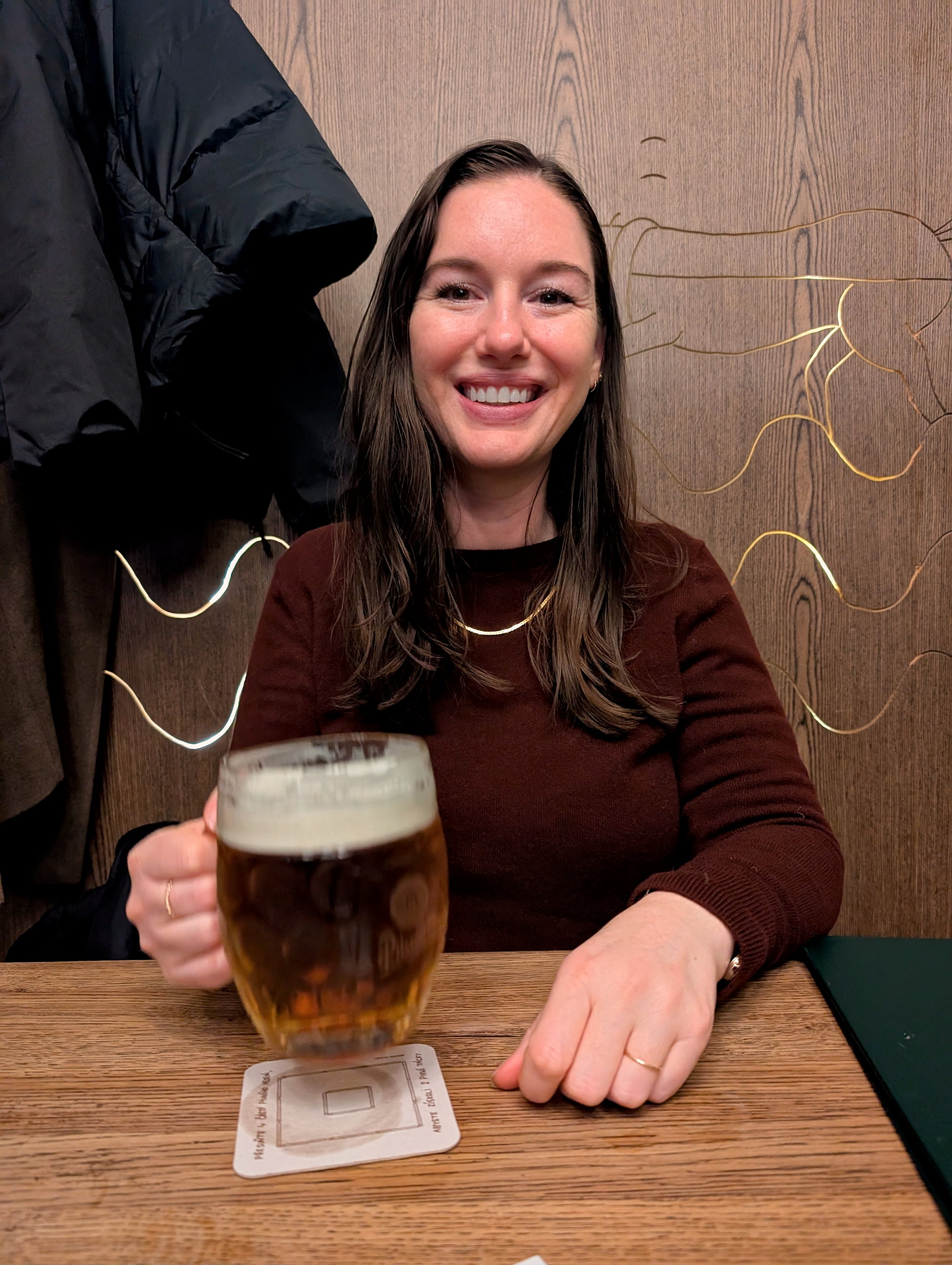 Alyssa with a beer in Prague