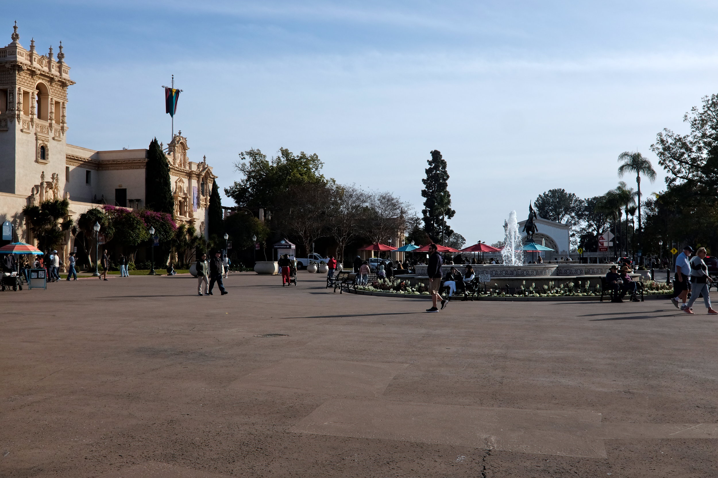 People walk around Balboa Park