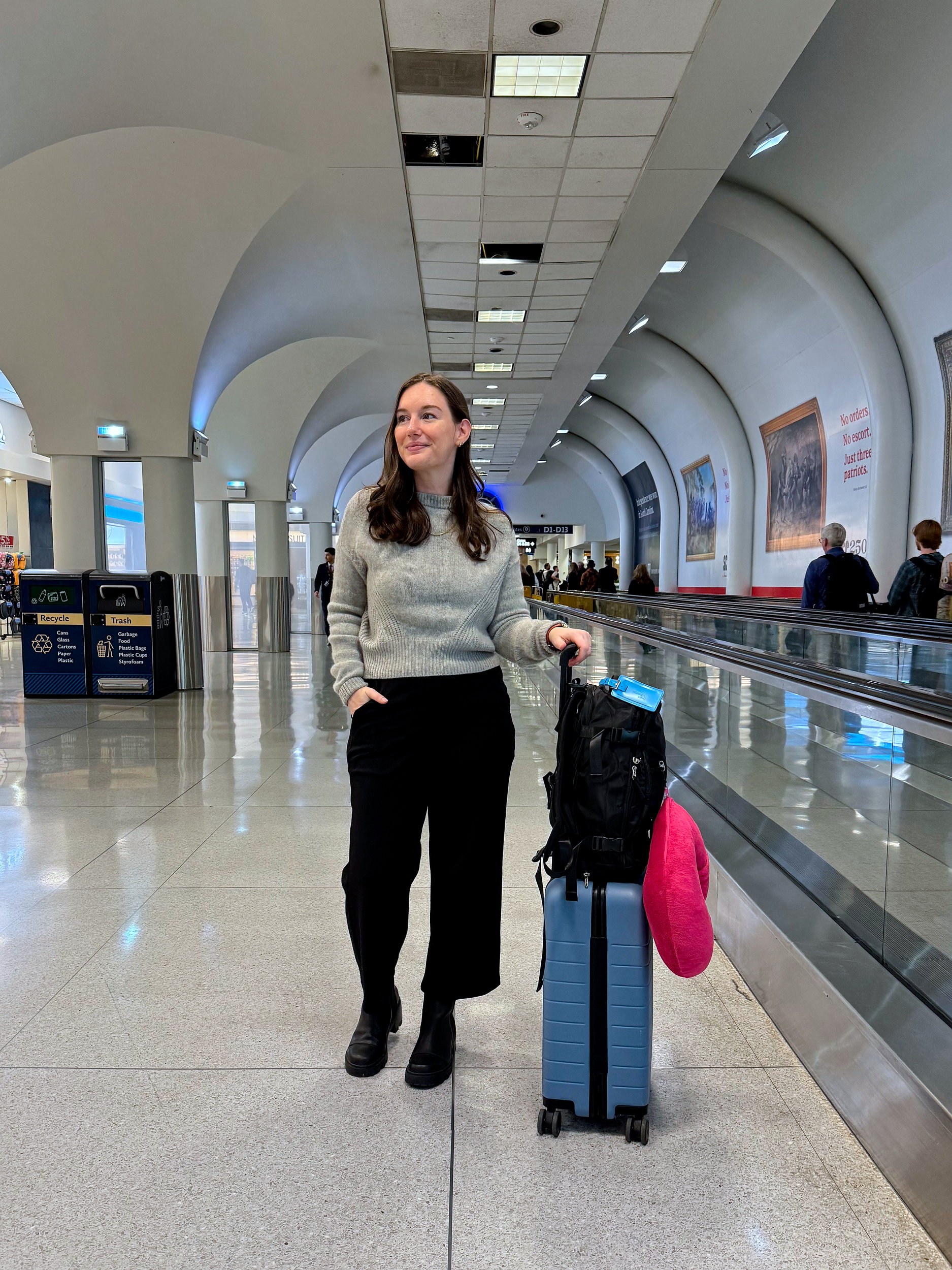 Alyssa in the Charlotte airport with her backpack for a Lufthansa flight