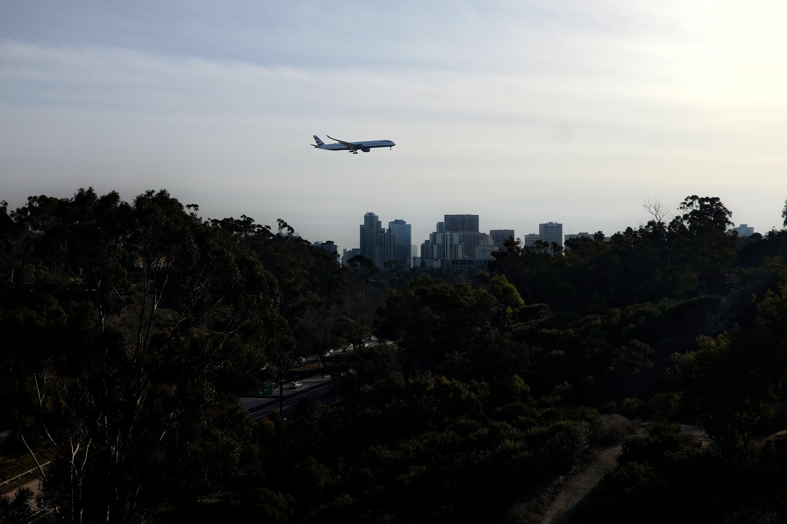 A British Airways flight crosses over downtown San Diego