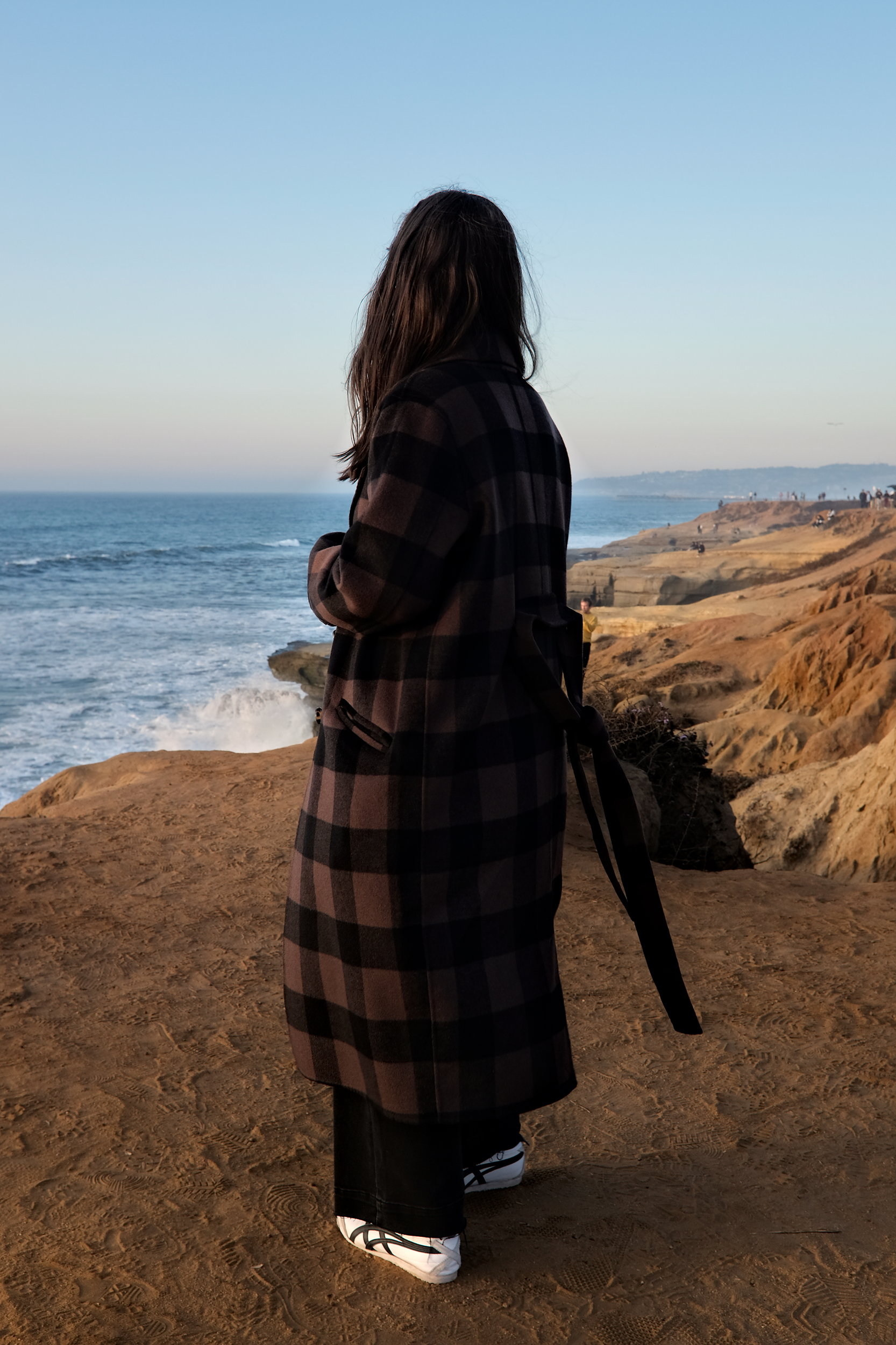 Alyssa looks out at the Pacific Ocean