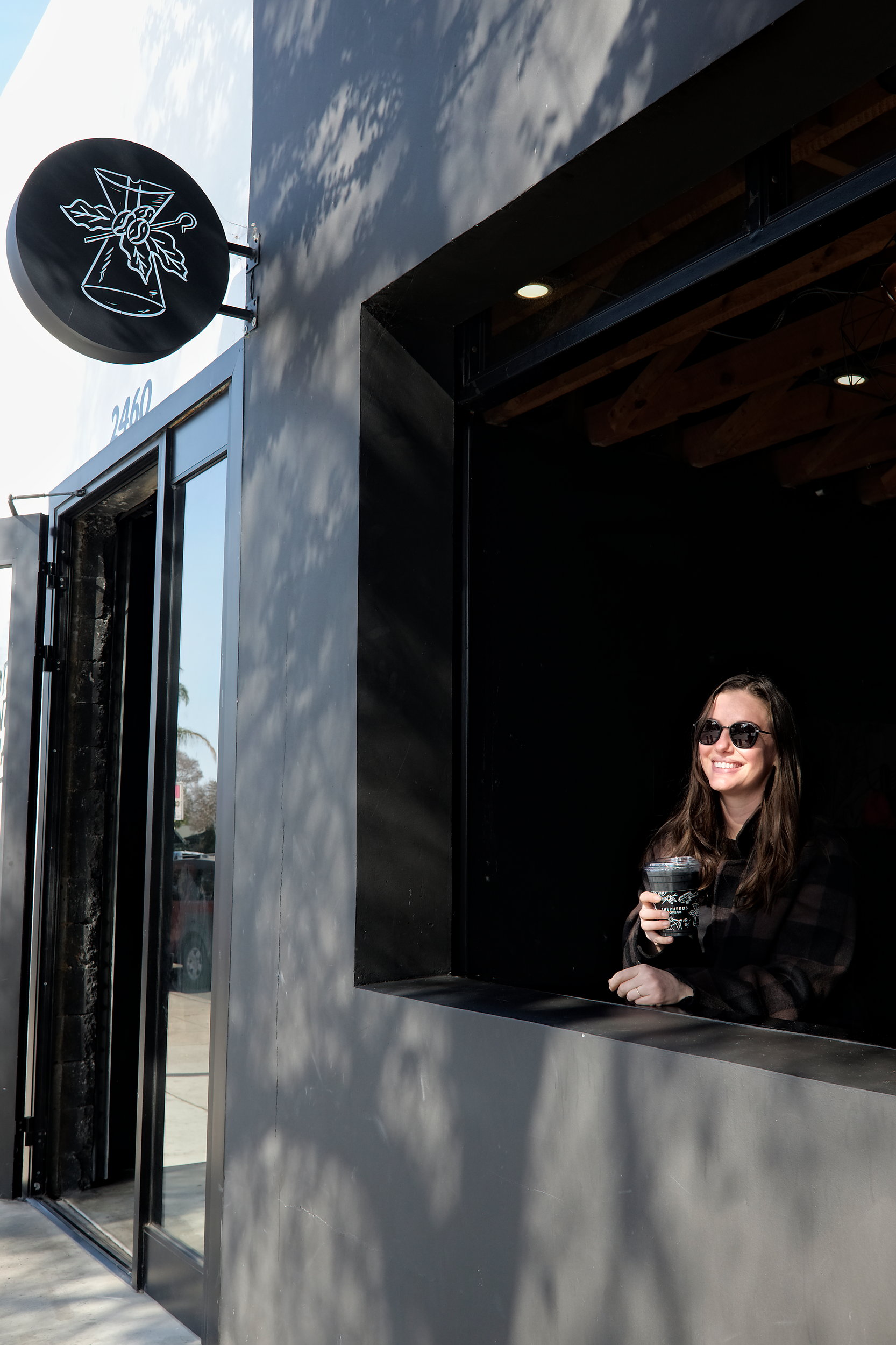 Alyssa in the window of Shepherds Coffee Co.