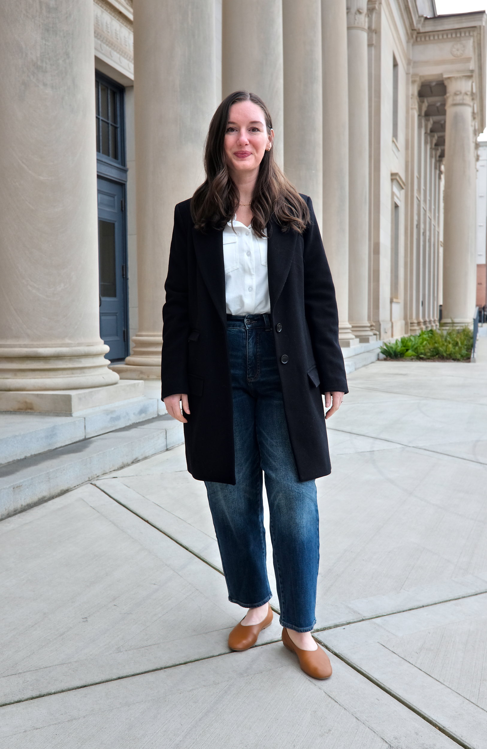 Alyssa wears the Harlow Classic Wool Coat with a white button down and jeans and flats