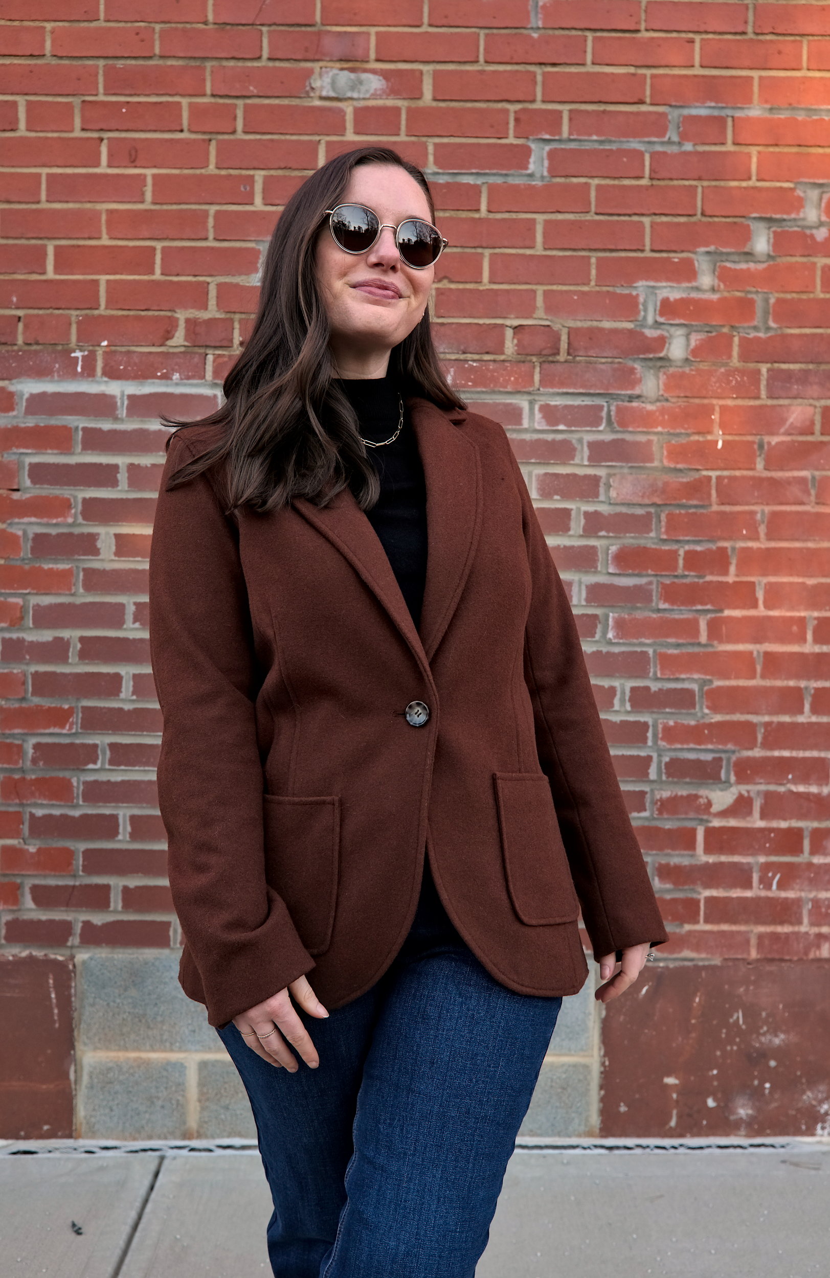 Alyssa wears the Kidjo Tailored Wool Jacket buttoned