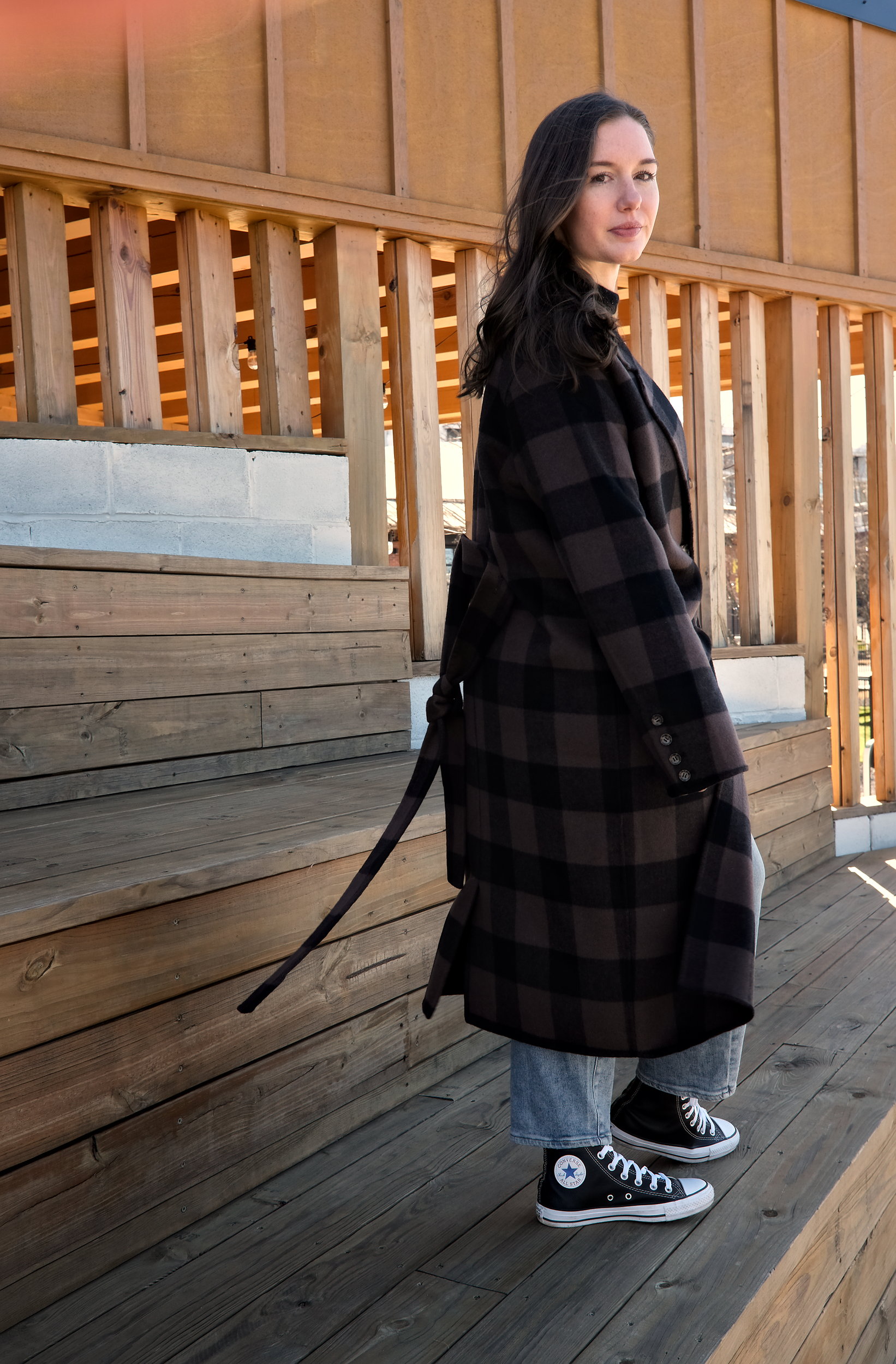 Alyssa wears the Double Face Luxe Coat in profile to the camera